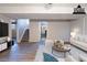 Bright living room boasts hardwood floors, and stairs leading to the upper level at 5938 Baywood Ln, Riverdale, GA 30296