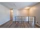 Bright living room featuring neutral color palette and hardwood floors, with an open stairway at 5938 Baywood Ln, Riverdale, GA 30296