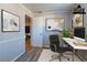 Home office features neutral walls, hardwood floors, and natural light at 5938 Baywood Ln, Riverdale, GA 30296