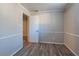 This bonus room boasts hardwood floors and neutral walls at 5938 Baywood Ln, Riverdale, GA 30296