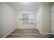 This bedroom features durable wood-look vinyl floors and white painted trim at 3375 River Mill Ln, Ellenwood, GA 30294