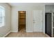 Kitchen entryway with a window and access to additional storage space at 920 Navajo Trl, Covington, GA 30016
