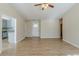 Bright living room with access to the kitchen and updated laminate flooring at 920 Navajo Trl, Covington, GA 30016