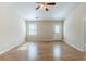 Open-concept living room featuring new laminate wood flooring and natural light at 920 Navajo Trl, Covington, GA 30016