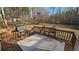 Enjoy outdoor living on the wooden deck, complete with a grill, bench, and expansive backyard view at 219 Thorncrest, Stockbridge, GA 30281