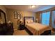 Cozy bedroom with neutral tones, comfortable bed, and decorative wall art at 219 Thorncrest, Stockbridge, GA 30281