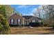 Brick and siding home with groomed landscaping, dark shutters, and a well-maintained lawn at 219 Thorncrest, Stockbridge, GA 30281
