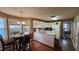 Spacious eat-in kitchen offers ample countertop space, white cabinets, and modern appliances with a dining area at 219 Thorncrest, Stockbridge, GA 30281