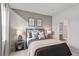 Stylish bedroom featuring a gray and white accent wall at 72 Sheryl Way, Loganville, GA 30052