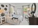 Cozy bedroom with a queen-size bed and large windows at 72 Sheryl Way, Loganville, GA 30052