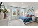 Light and airy bedroom with unique wall decor at 72 Sheryl Way, Loganville, GA 30052