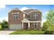 Two-story brick home with a green door and attached garage at 72 Sheryl Way, Loganville, GA 30052