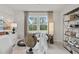 Bright home office features large windows, built-in shelving, and comfortable seating at 72 Sheryl Way, Loganville, GA 30052