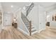 Modern staircase with metal railing at 72 Sheryl Way, Loganville, GA 30052
