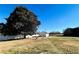 Large backyard with detached garage and mature trees at 11 Triplet Trail, Douglasville, GA 30134