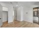 Light-filled bedroom featuring hardwood floors and built-in closet at 4063 Rickenbacker Dr, Atlanta, GA 30342