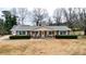 Ranch home with large yard, showcasing the front and side of house at 3649 Pinehill Cir, Acworth, GA 30101