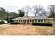 House with a spacious yard, showcasing the front and side of house at 3649 Pinehill Cir, Acworth, GA 30101