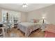 Cozy bedroom with hardwood floors and a desk at 3649 Pinehill Cir, Acworth, GA 30101