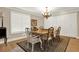 Elegant dining room with hardwood floors, built-in cabinetry, and chandelier at 3649 Pinehill Cir, Acworth, GA 30101