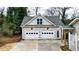 Two-car garage with dormer windows and light fixtures at 3649 Pinehill Cir, Acworth, GA 30101