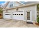 Two-car garage with extra storage and access door at 3649 Pinehill Cir, Acworth, GA 30101