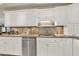 Modern kitchen with white cabinets, granite countertops, and stainless steel dishwasher at 3649 Pinehill Cir, Acworth, GA 30101