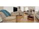 Spacious living room with hardwood floors, comfortable seating, and large windows at 3649 Pinehill Cir, Acworth, GA 30101