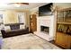 Living room featuring fireplace, built-in shelving, and hardwood floors at 4770 Quail Hunt Ct, Powder Springs, GA 30127