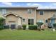 A full view of the backyard, featuring manicured grass, mature landscaping, and a home exterior at 382 Northdale Ct, Lawrenceville, GA 30046