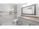 Modern bathroom with glass-enclosed shower and granite vanity top at 382 Northdale Ct, Lawrenceville, GA 30046