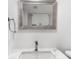 Bright bathroom featuring a modern sink, framed mirror, and white marbled countertop at 382 Northdale Ct, Lawrenceville, GA 30046