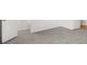 Bright bedroom featuring plush gray carpeting and a white door at 382 Northdale Ct, Lawrenceville, GA 30046