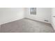 Spacious bedroom with natural light from a window and gray carpet at 382 Northdale Ct, Lawrenceville, GA 30046