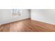 Bright bedroom featuring hardwood floors, natural light, and a view of the outdoors at 382 Northdale Ct, Lawrenceville, GA 30046