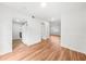 Bright empty room features hardwood floors and sliding glass doors to the outside at 382 Northdale Ct, Lawrenceville, GA 30046