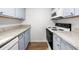 Kitchen features granite countertops, white tile backsplash, and stainless steel appliances at 382 Northdale Ct, Lawrenceville, GA 30046