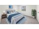 Bright main bedroom with a window, plush carpet, and queen-sized bed at 382 Northdale Ct, Lawrenceville, GA 30046