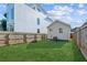 Backyard view showing studio, fence, and grassy area at 453 Mary Sw St, Atlanta, GA 30310
