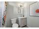Clean bathroom with a single vanity, toilet, and shower/tub combo at 453 Mary Sw St, Atlanta, GA 30310