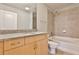 Well-lit bathroom featuring a granite countertop, tiled shower, and modern fixtures at 860 Peachtree Ne St # 2506, Atlanta, GA 30308