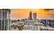Breathtaking view of the city skyline showcasing modern architecture and vibrant urban landscape bathed in a warm sunset glow at 860 Peachtree Ne St # 2506, Atlanta, GA 30308