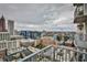 Expansive city view from a high-rise balcony, showcasing architectural diversity and urban landscape at 860 Peachtree Ne St # 2506, Atlanta, GA 30308