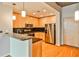 Modern kitchen with stainless steel appliances, granite countertops and wooden cabinets at 860 Peachtree Ne St # 2506, Atlanta, GA 30308