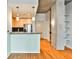 Modern kitchen with stainless steel appliances, granite countertops and adjacent hallway at 860 Peachtree Ne St # 2506, Atlanta, GA 30308