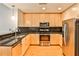 Modern kitchen with stainless steel appliances, black backsplash and granite countertops at 860 Peachtree Ne St # 2506, Atlanta, GA 30308