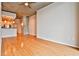 Open-concept living room with hardwood floors, a modern kitchen, and bright, airy space at 860 Peachtree Ne St # 2506, Atlanta, GA 30308