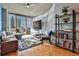 Bright living room with a city view, featuring modern furniture, hardwood floors, and an entertainment center at 860 Peachtree Ne St # 2506, Atlanta, GA 30308
