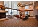 Spacious lounge with fireplace, comfortable seating, and large windows offering city views at 860 Peachtree Ne St # 2506, Atlanta, GA 30308