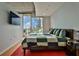 Cozy main bedroom with large windows offering city views, stylish decor, and a comfortable bed at 860 Peachtree Ne St # 2506, Atlanta, GA 30308